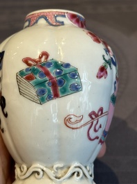 A pair of Chinese famille rose 'antiquities' tea caddies and covers, Yongzheng/Qianlong