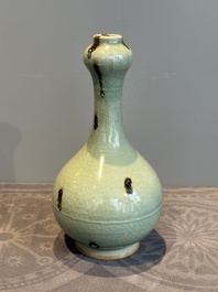 A Chinese russet-splashed Longquan celadon garlic-mouth vase, Yuan/Ming