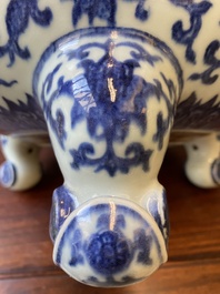 A large Chinese blue and white 'bajixiang' and 'lotus scrolls' tripod censer, Qianlong
