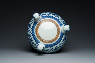 A large Chinese blue and white 'bajixiang' and 'lotus scrolls' tripod censer, Qianlong