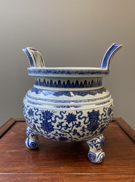 A large Chinese blue and white 'bajixiang' and 'lotus scrolls' tripod censer, Qianlong