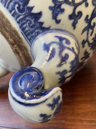 A large Chinese blue and white 'bajixiang' and 'lotus scrolls' tripod censer, Qianlong