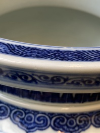 A large Chinese blue and white 'bajixiang' and 'lotus scrolls' tripod censer, Qianlong