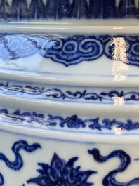 A large Chinese blue and white 'bajixiang' and 'lotus scrolls' tripod censer, Qianlong