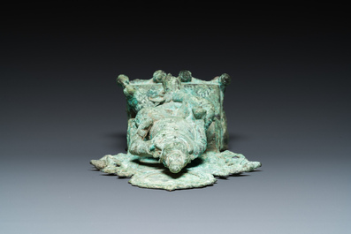 A bronze group with Kubera on throne, Central Java, Indonesia, 11/12th C.