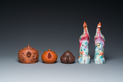 Three Chinese Yixing stoneware teapots and a pair of famille rose phoenixes, 19/20th C.
