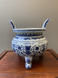 A large Chinese blue and white 'bajixiang' and 'lotus scrolls' tripod censer, Qianlong