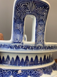 A large Chinese blue and white 'bajixiang' and 'lotus scrolls' tripod censer, Qianlong