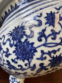 A large Chinese blue and white 'bajixiang' and 'lotus scrolls' tripod censer, Qianlong
