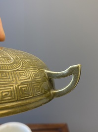 A Chinese teadust-glazed archaistic food vessel and cover, 'dui 敦', Hua Ting Shi Zhi 華亭氏製 mark, late 19th C.
