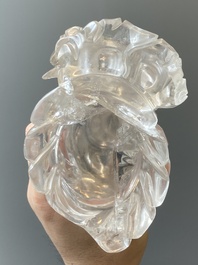 A Chinese rock crystal sculpture of Lan Caihe on wooden stand, 19th C.