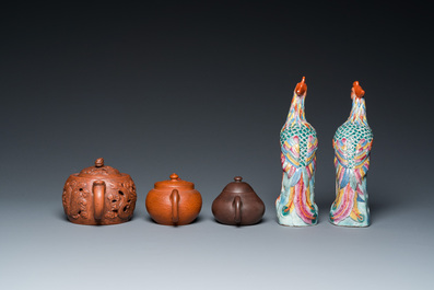Three Chinese Yixing stoneware teapots and a pair of famille rose phoenixes, 19/20th C.
