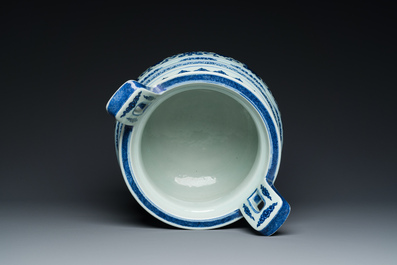 A large Chinese blue and white 'bajixiang' and 'lotus scrolls' tripod censer, Qianlong