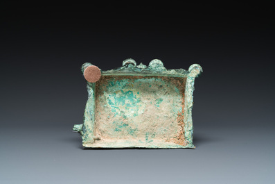 A bronze group with Kubera on throne, Central Java, Indonesia, 11/12th C.