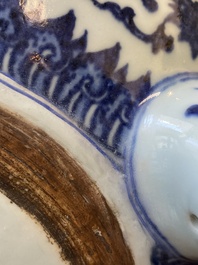 A large Chinese blue and white 'bajixiang' and 'lotus scrolls' tripod censer, Qianlong