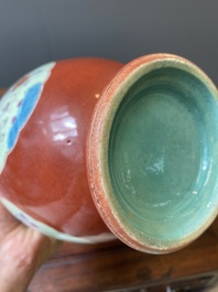 A pair of Chinese famille rose coral-red-ground vases with playing boys, 18/19th C.
