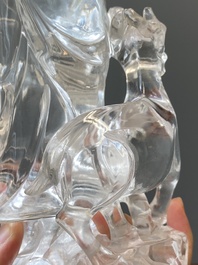 A Chinese rock crystal sculpture of Lan Caihe on wooden stand, 19th C.