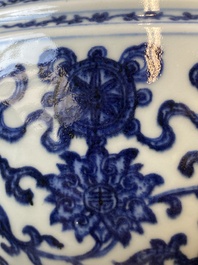 A large Chinese blue and white 'bajixiang' and 'lotus scrolls' tripod censer, Qianlong