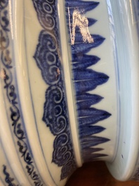 A large Chinese blue and white 'bajixiang' and 'lotus scrolls' tripod censer, Qianlong
