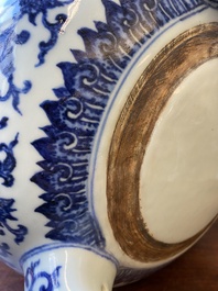 A large Chinese blue and white 'bajixiang' and 'lotus scrolls' tripod censer, Qianlong
