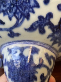 A large Chinese blue and white 'bajixiang' and 'lotus scrolls' tripod censer, Qianlong