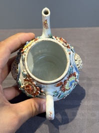A Chinese famille rose teapot and stand with floral relief design, Qianlong