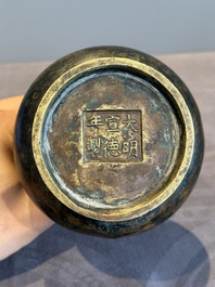 A small Chinese bronze bottle vase with lion-form handles, Qing, 17th C.