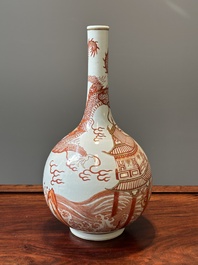 A Chinese iron-red gilt-decorated 'dragon and carp' bottle vase, 19/20th C.