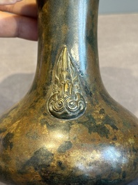 A small Chinese bronze bottle vase with lion-form handles, Qing, 17th C.