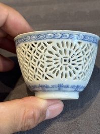 A Chinese blue and white reticulated double-walled cup and saucer, lingzhi mark, Kangxi