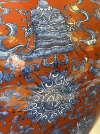 A Chinese blue, white and iron-red 'bajixiang' 'hu' vase on wooden stand, Qianlong mark, 19th C.