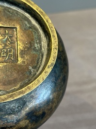 A small Chinese bronze bottle vase with lion-form handles, Qing, 17th C.