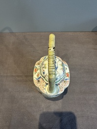 A Chinese famille verte 'flower and butterfly' teapot with an upright handle, Kangxi