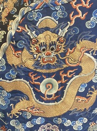 A Chinese gold thread embroidered blue-ground silk 'dragon' robe, 19th C.