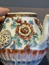 A Chinese famille rose teapot and stand with floral relief design, Qianlong