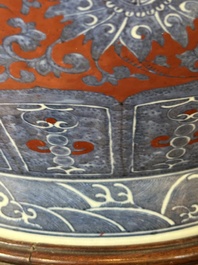 A Chinese blue, white and iron-red 'bajixiang' 'hu' vase on wooden stand, Qianlong mark, 19th C.