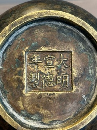 A small Chinese bronze bottle vase with lion-form handles, Qing, 17th C.