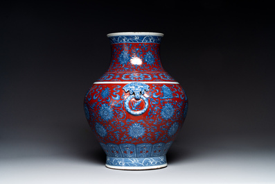 A Chinese blue, white and iron-red 'bajixiang' 'hu' vase on wooden stand, Qianlong mark, 19th C.