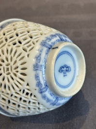 A Chinese blue and white reticulated double-walled cup and saucer, lingzhi mark, Kangxi