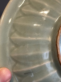 A Chinese Longquan celadon 'twin fish' plate, Yuan/Ming