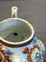 A Chinese famille rose teapot and stand with floral relief design, Qianlong
