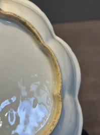 A Chinese famille rose teapot and stand with floral relief design, Qianlong