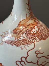 A Chinese iron-red gilt-decorated 'dragon and carp' bottle vase, 19/20th C.