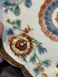 A Chinese famille rose teapot and stand with floral relief design, Qianlong