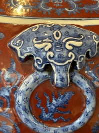A Chinese blue, white and iron-red 'bajixiang' 'hu' vase on wooden stand, Qianlong mark, 19th C.