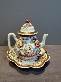 A Chinese famille rose teapot and stand with floral relief design, Qianlong