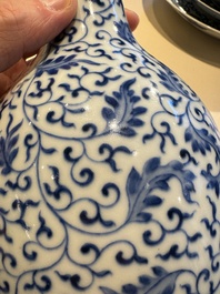 A Chinese blue and white 'lotus scroll' bottle vase, Yongzheng mark, 19/20th C.