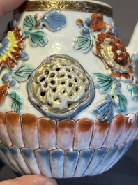 A Chinese famille rose teapot and stand with floral relief design, Qianlong