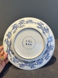 A Chinese blue and white 'Eight Immortals' dish, Xuande mark, 19th C.