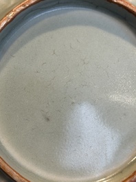 A Chinese Longquan celadon 'twin fish' plate, Yuan/Ming